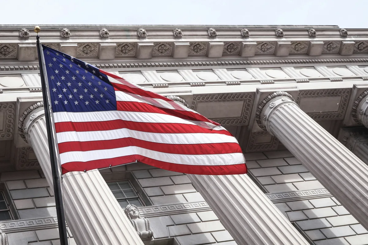 American flag near a municipal building, representing state tipped wage laws